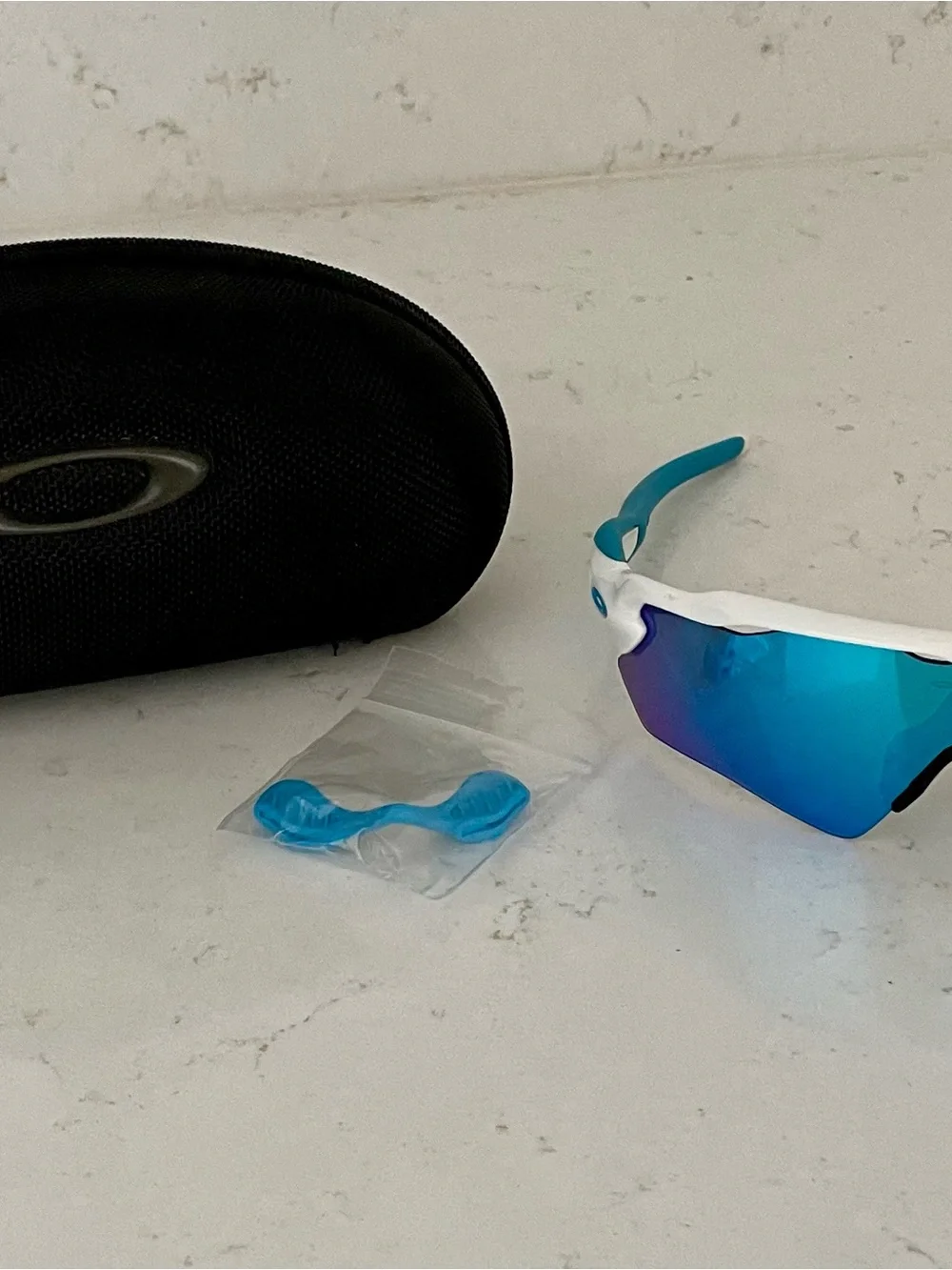 Oakley White Frame Sunglasses with Blue Lenses and Blue Temple Tips
